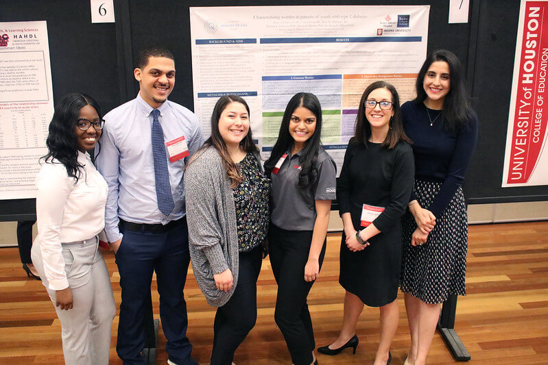 University of Houston/MD Anderson Cancer Center (UHAND) program mentees presenting their research during the student poster session.
