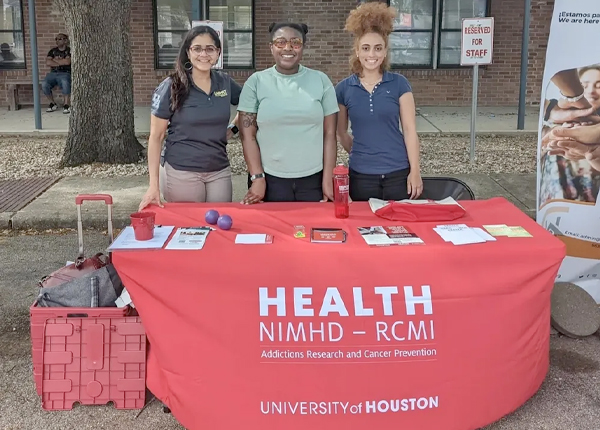 Event table with (from left to right) Virmarie Correa-Fernandez, Shalan Washington and Evan Coleman.