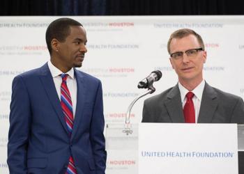 Dan O'Connor and Ezemenari Obasi speaking at United Health Foundation grant announcement event