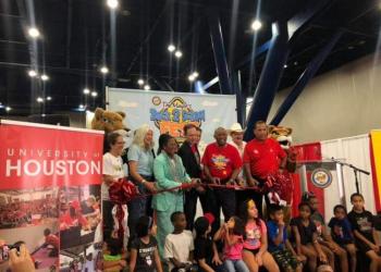 Houston Mayor and community leaders with local children 
