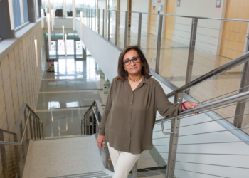 Portrait of Dr. Samina Salim on a staircase on UH campus