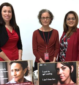 Portrait of Dr. Lorraine Reitzel, Dr. Isabel Martinez Leal, and Virmarie Correa-Fernandez with TTTF printed collateral spread across a table in the foreground.