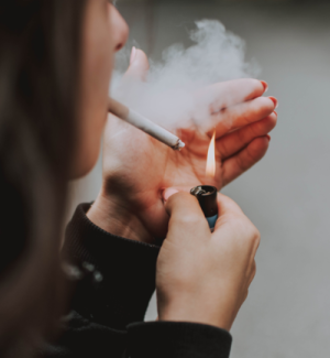 Photo by lil artsy for Pexels showing a woman smoking a cigarette