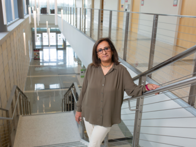 Portrait of Dr. Samina Salim on a staircase on UH campus