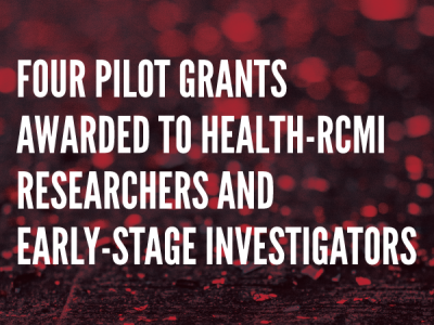 Image of red confetti on a black background with text in a condensed, bold typeface (in all caps) that reads, "Four Pilot Grants Awarded to HEALTH-RCMI Researchers and Early-Stage Investigators"