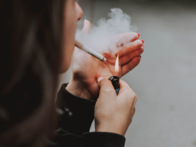Photo by lil artsy for Pexels showing a woman smoking a cigarette